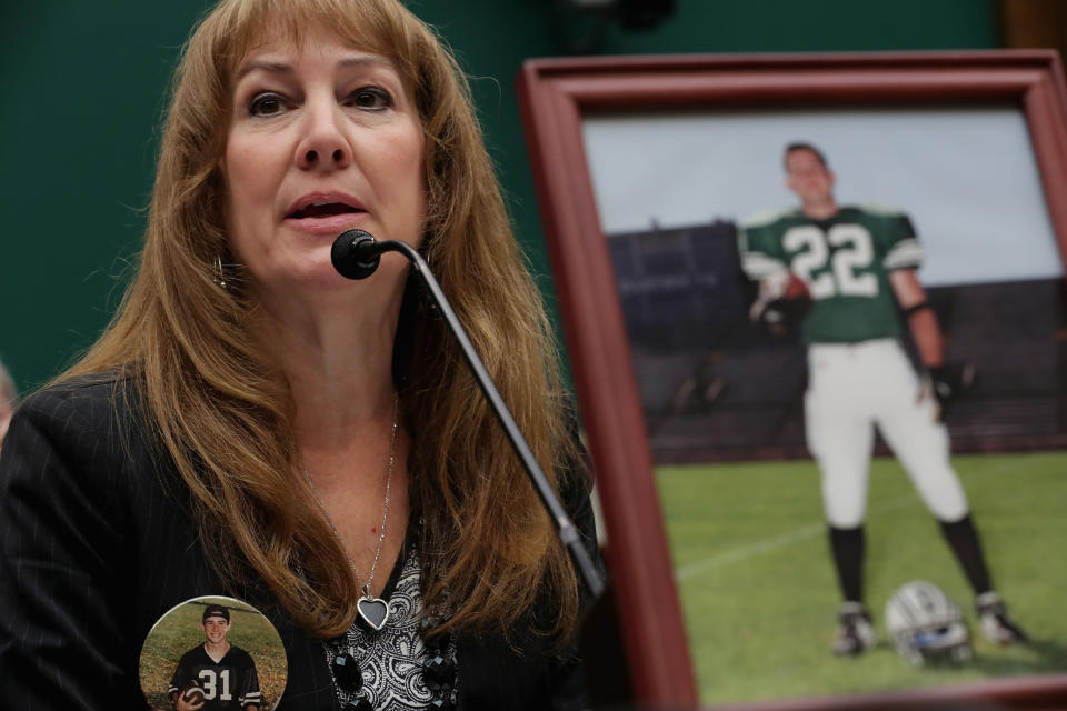 Karen Zegel, whose son Patrick Risha (photograph on the table) took his own life after suffering from chronic traumatic encephalopathy, testifies before the House Energy and Commerce Subcommittee on&nbsp;Oversight and Investigations during a hearing about concussions in youth sports in the Rayburn House Office Building on Capitol Hill on May 13, 2016.