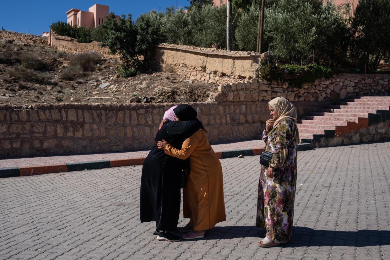 MOULAY BRAHIM, MOROCCO - SEPTEMBER 10: Women hug each other on September 10, 2023 in Moulay Brahim, Morocco. An earthquake measuring 6.8 on the Richter scale hit central Morocco. Although the epicenter was in a sparsely populated area of the High Atlas Mountains, the effects have been felt 71km away in Marrakesh, a major tourist destination, where many buildings have collapsed and over 2,000 deaths have been reported. (Photo by Carl Court/Getty Images) (Getty Images)