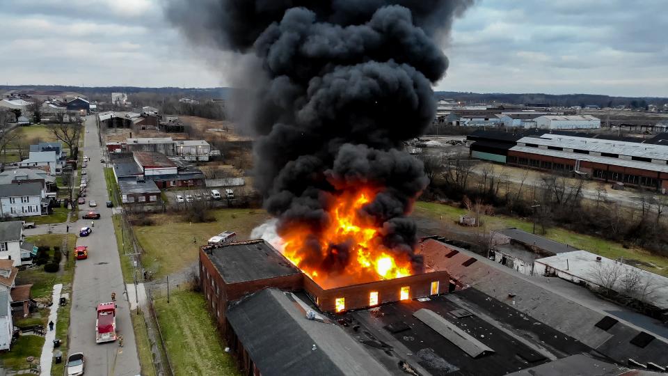 Fire tore through the abandoned Weber Dental building in December 2020.