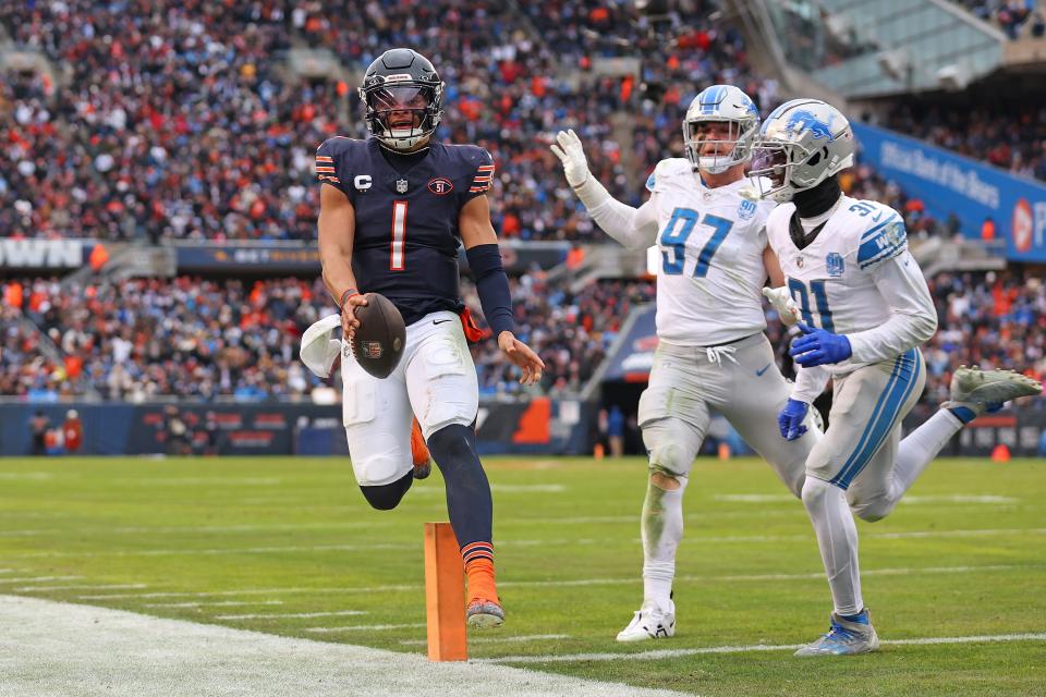 Bears quarterback Justin Fields runs the ball for a touchdown during the fourth quarter on Sunday, Dec. 10, 2023, in Chicago.