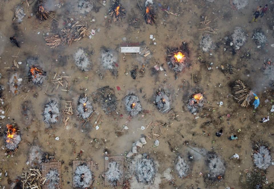 A mass cremation of victims who died due to the coronavirus disease (COVID-19), is seen at a crematorium ground in New Delhi, India, April 22, 2021. Picture taken with a drone. REUTERS/Danish Siddiqui     TPX IMAGES OF THE DAY