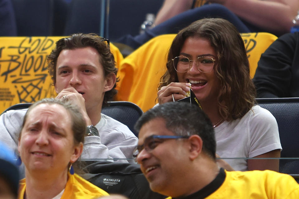 Tom Holland and Zendaya at a basketball game