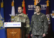 U.S. Army's Col. Lee Peters, director of Public Affairs of United States Forces Korea, and Col. Kim Jun-rak, of South Korea's Joint Chiefs of Staff brief about the their postponed joint militaries drills to the media at Defense Ministry in Seoul, South Korea, Thursday, Feb. 27, 2020. The South Korean and U.S. militaries have postponed their annual joint drills out of concerns over a virus outbreak. (Korea Pool/Yonhap via AP)