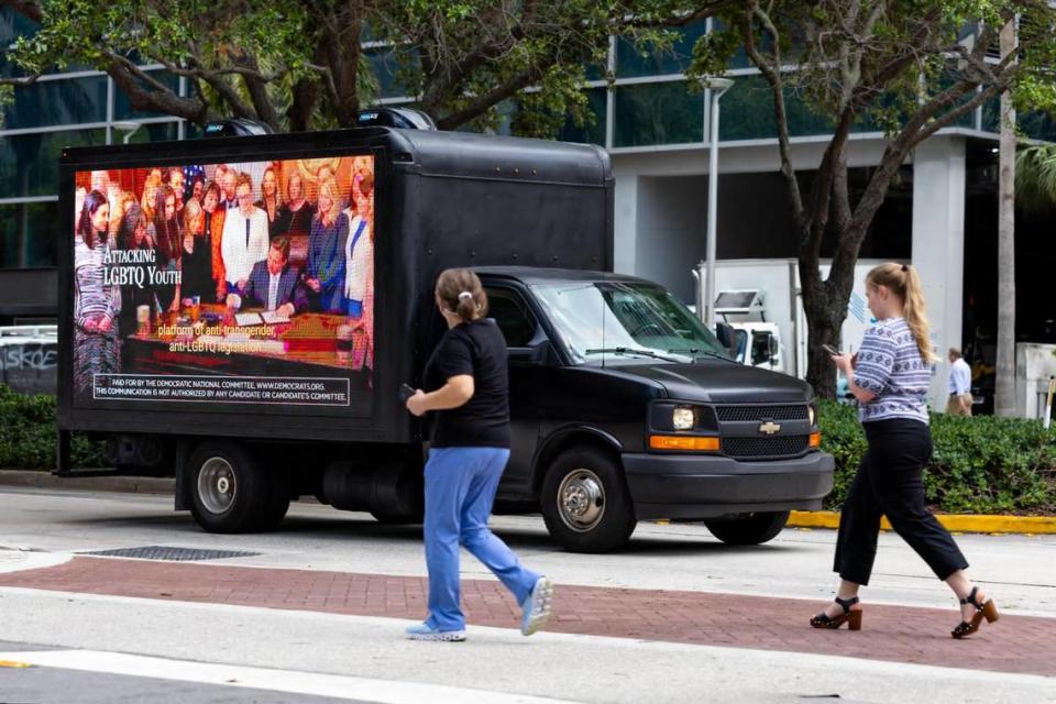 A billboard truck circles the Miami Four Seasons hotel on Brickell Avenue on Wednesday, May 24, 2023, as supporters of Gov. Ron DeSantis gather for the start of this campaign for the Republican nomination for president. The billboard showed attack ads by the Democratic National Committee slamming DeSantis as an out-of-touch conservative.