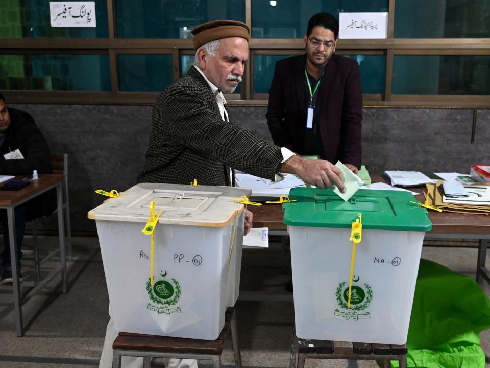 A man casts his ballot to vote at a polling station during Pakistan’s national elections in Lahore on February 8, 2024 (AFP via Getty Images)