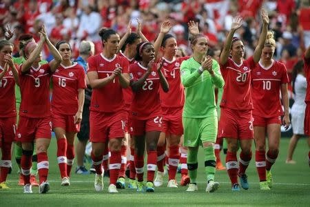 Jun 27, 2015; Vancouver, British Columbia, CAN; Canada players salute the fans after losing to England in the quarterfinals of the FIFA 2015 Women's World Cup at BC Place Stadium. England won 2-1. Mandatory Credit: Matt Kryger-USA TODAY Sports