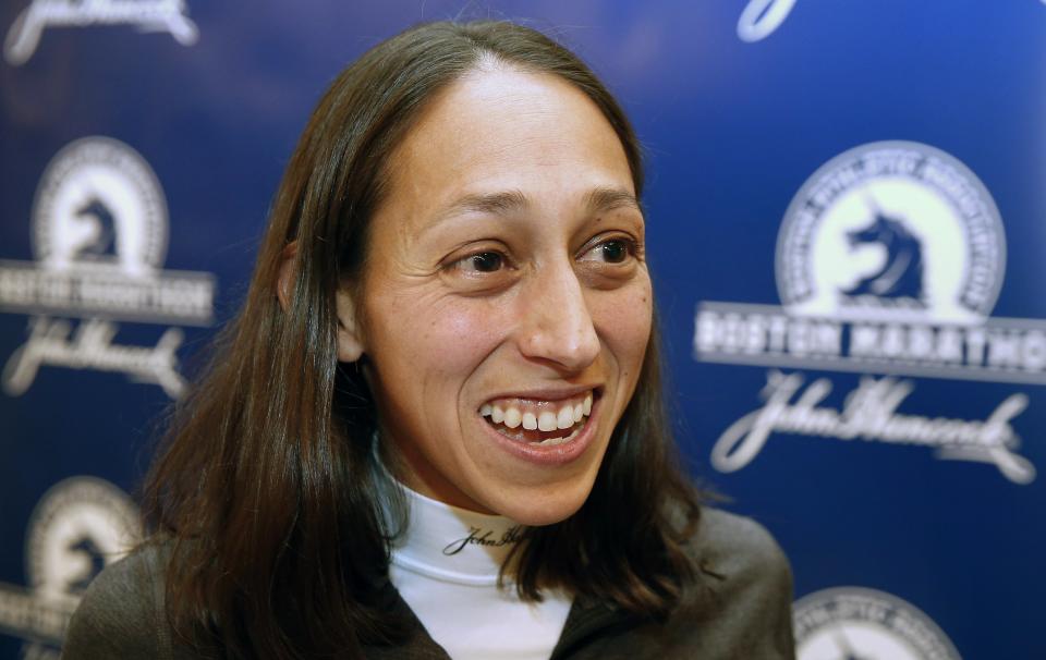 FILE - Des Linden speaks with a reporter during a media availability prior to the 120th running of the Boston Marathon in Boston, April 15, 2016. A 38-year-old Kenyan who has been collecting marathon victories since 2013, Eliud Kipchoge will make his Boston Marathon debut on Monday, April 17, 2023, in the 127th edition of the world’s longest-running long run. “I think he can be very content. But there would always be that question mark: How would he do on this course? And could he get it done and win here?” said Linden, a two-time Olympian and the 2018 Boston champion. “So it’s great that he’s coming out to get that answer.” (AP Photo/Michael Dwyer, File)