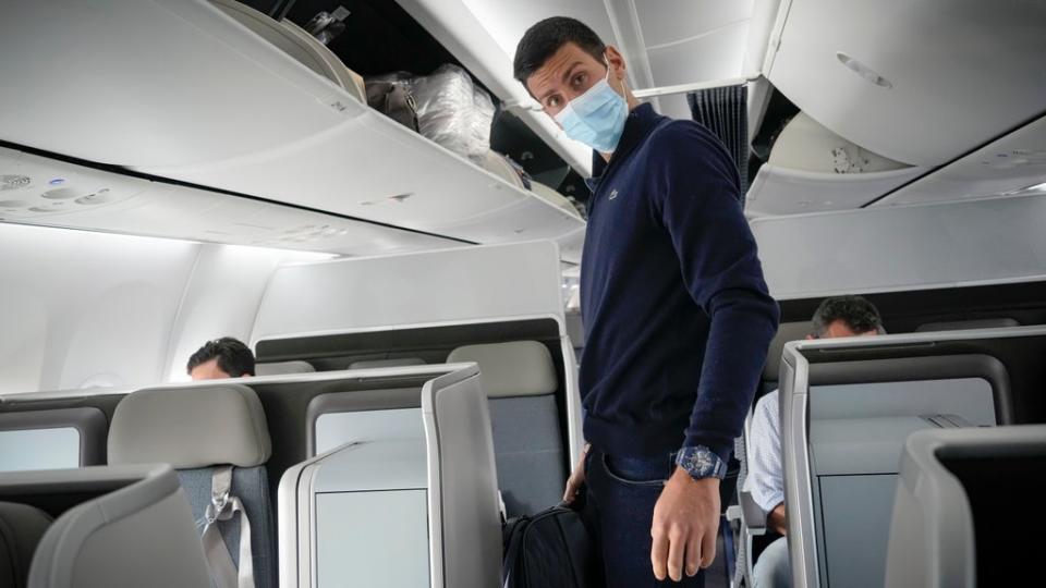 Novak Djokovic preparing to take his seat on a plane to Belgrade, in Dubai, on Monday (Darko Bandic/AP) (AP)