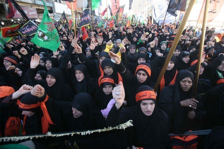 Shiite Muslim women attend the Arbaeen religious festival in Karbala, Iraq, on January 3, 2013. A truck bomb killed 19 worshippers south of Baghdad on Thursday as pilgrims from around the world thronged Iraq's shrine city to finish commemorations for a revered figure in Shiite Islam