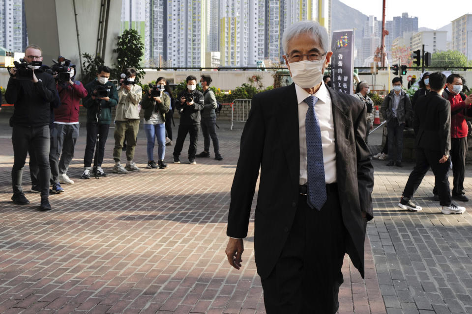 Pro-democracy lawmaker Martin Lee arrives at a court in Hong Kong Tuesday, Feb. 16, 2021. Nine prominent Hong Kong's democracy advocates faced trial Tuesday on charges of organizing an unauthorized assembly in August 2019. Among the defendants veteran octogenarian lawyer and dubbed Hong Kong's "father of democracy" Lee and media tycoon Jimmy Lai. (AP Photo/Vincent Yu)