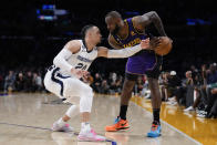 Memphis Grizzlies forward Dillon Brooks (24) defends against Los Angeles Lakers forward LeBron James (6) during the second half of an NBA basketball game in Los Angeles, Friday, Jan. 20, 2023. (AP Photo/Ashley Landis)