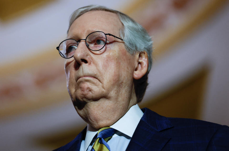 Senate Minority Leader Mitch McConnell, R-Ky., listens to his Republican colleagues.