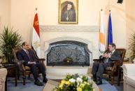 Cyprus' President Nicos Anastasiades and Egypt's President Abdel Fattah al-Sisi talk during a meeting at a trilateral summit between Greece, Cyprus and Egypt, at the Presidential Palace in Nicosia