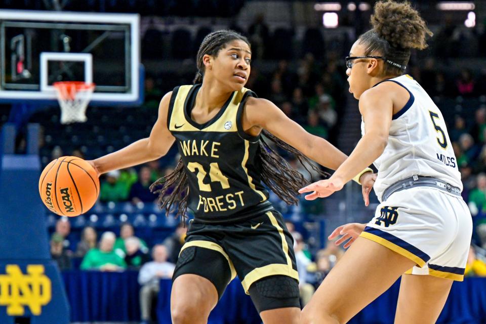 Jan 12, 2023; South Bend, Indiana, USA; Wake Forest Demon Deacons guard Jewel Spear (24) dribbles as Notre Dame Fighting Irish guard Olivia Miles (5) defends in the first half at the Purcell Pavilion. Mandatory Credit: Matt Cashore-USA TODAY Sports