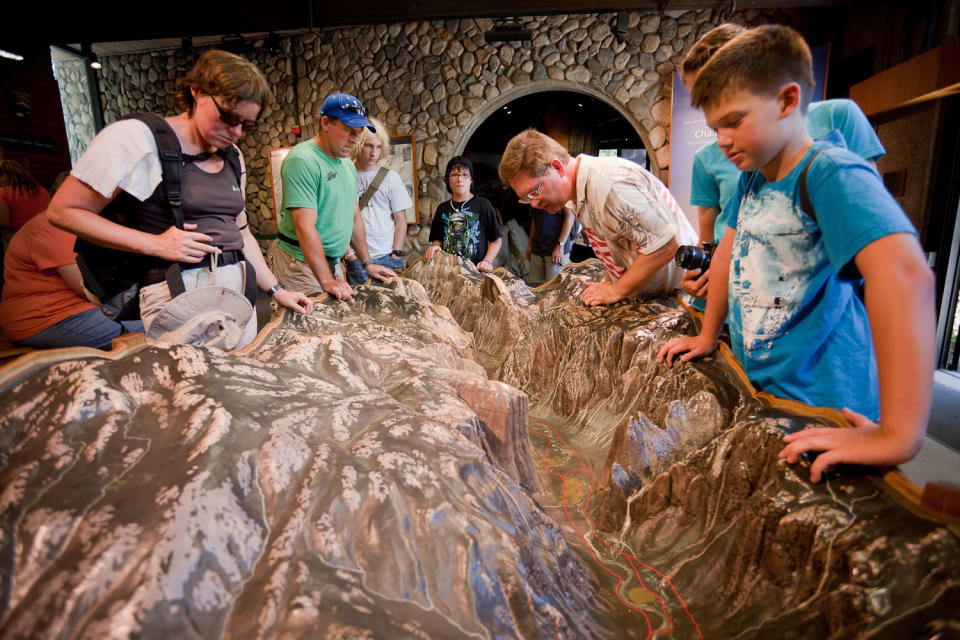 Visitors check out the scale model of Yosemite Valley in the Visitors Center.