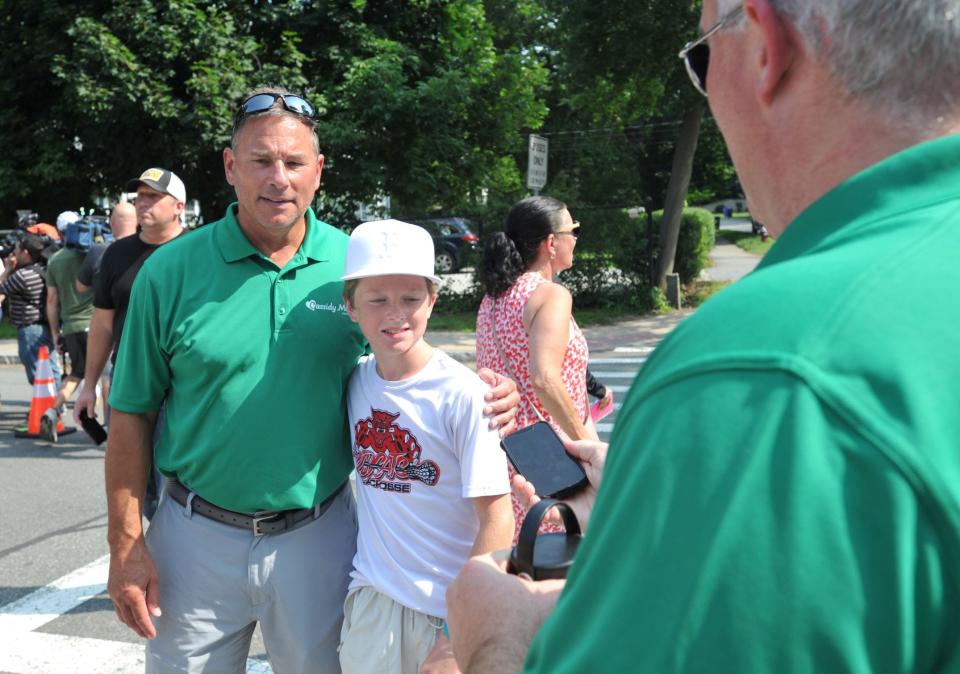 Bruce Cassidy, left, former Boston Bruins coach and current head coach of the Vegas Golden Knights, is joined by Brian Brems, 12, of Milton, for a picture during the kickoff of the Cassidy Murray Foundation, which included a visit by the Stanley Cup, in Milton, Thursday, July 13, 2023.
