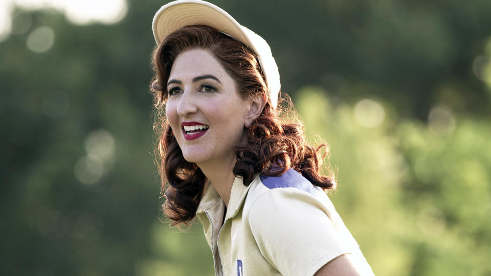 D'Arcy Carden (Greta) smiles on the field in A League of Their Own