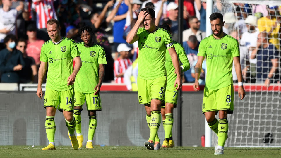 Manchester United players look dejected after theor loss to Brentford.