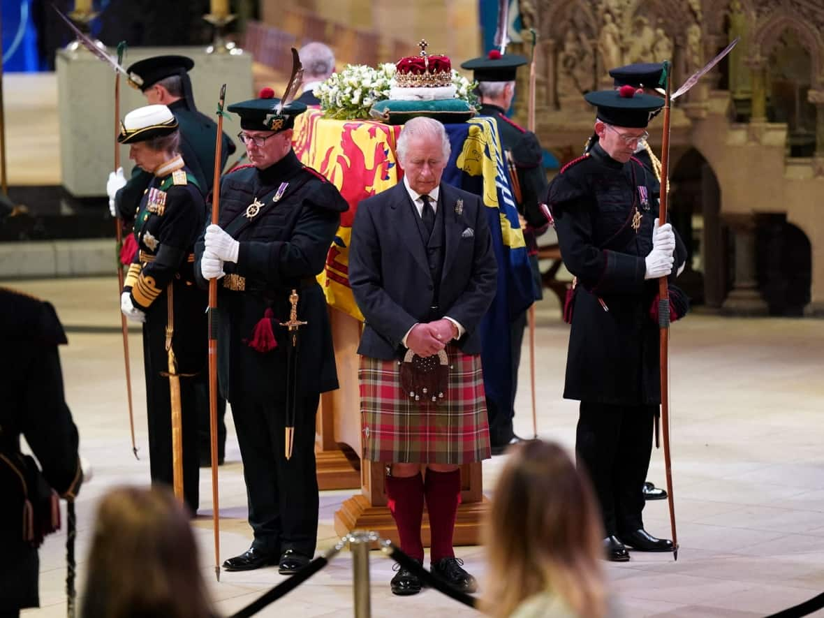 King Charles and his siblings hold a vigil around Queen Elizabeth's casket at St. Giles' Cathedral in Edinburgh on Monday. Her coffin was flown to London on Tuesday, and it will lie in state for four days ahead of her funeral on Sept. 19. (Jane Barlow/Reuters - image credit)