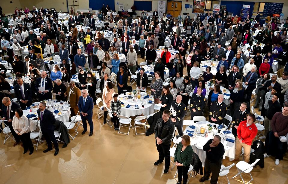 Attendees stand during the 39th Annual Martin Luther King Jr. Community Breakfast Monday at Assumption University honoring Martin Luther King Jr..