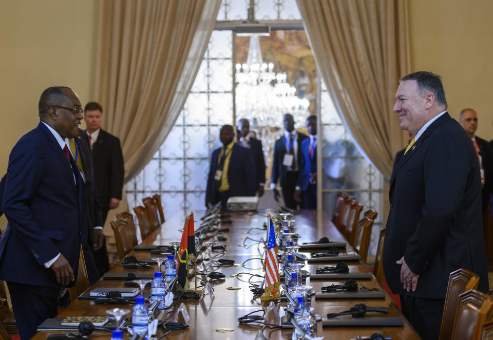 US Secretary of State, Mike Pompeo, right, meets with Angola Foreign Minister, Manuel Domingos Augusto before a press conference at the Ministry of Foreign Affairs in Luanda, Angola, Monday Feb. 17, 2020. Pompeo started his tour of Africa in Senegal, the first U.S. Cabinet official to visit in more than 18 months. He left Senegal Sunday to arrive in Angola and will then travel on to Ethiopia as the Trump administration tries to counter the growing interest of China, Russia and other global powers in Africa and its booming young population of more than 1.2 billion. (Andrew Caballero-Reynolds/Pool via AP)