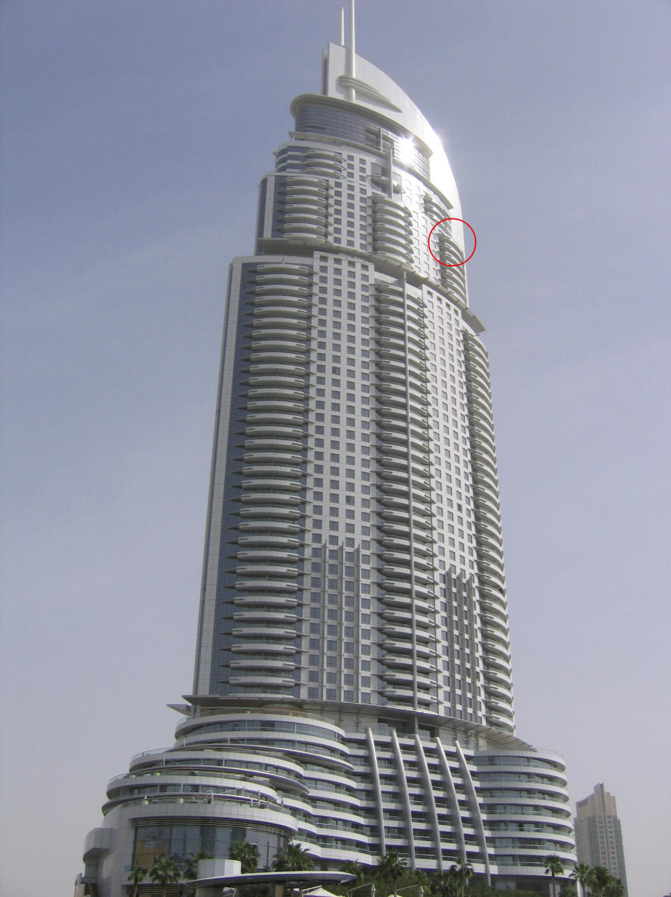 The balcony where Zohaib Anjum from Dubai took pictures of window cleaners. See SWNS copy SWCAwindows: These vertigo-inducing pictures show brave window cleaners working hundreds of feet above the clouds on some of the world’s tallest buildings. Two laid-back workmen were spotted hanging by two wires from one of the city’s tallest skyscrapers as they went about their daily business. The palm-sweating images were taken by Zohaib Anjum at the Address Downtown building in Dubai.