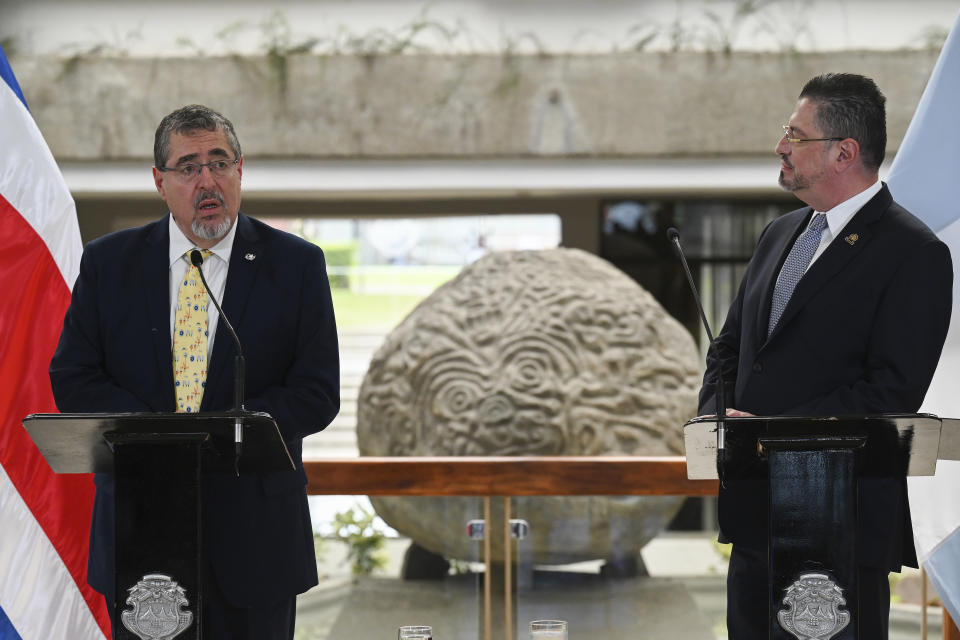 Guatemalan President-elect Bernardo Arévalo, left, speaks accompanied by Costa Rica President Rodrigo Chaves, during a welcoming ceremony in San Jose, Costa Rica, Wednesday, Dec. 13, 2023. Chaves received Arévalo Wednesday as the visiting politician tries to face down prosecutors’ attempts at home to derail his inauguration in barely a month’s time. (AP Photo/Carlos Gonzalez)