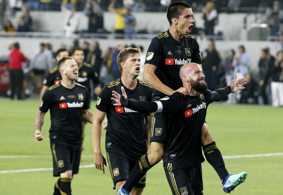 LAFC players celebrate after Laurent Ciman’s game-winning strike against Seattle. (AP)