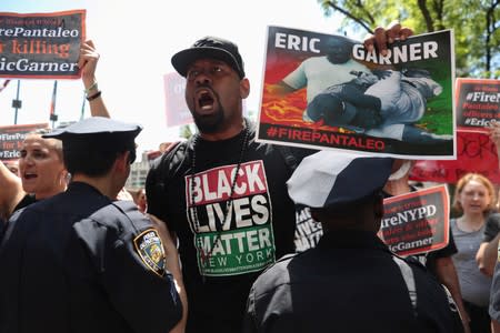 Demonstrators protest during the disciplinary trial of police officer Daniel Pantaleo in relation to the death of Eric Garner at 1 Police Plaza in New York City