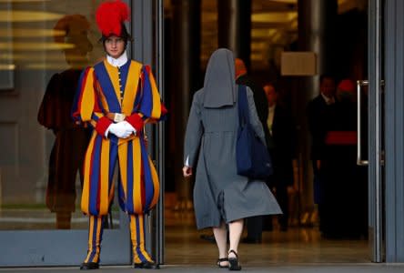 FILE PHOTO: A nun enters to take part at the synod afternoon session led by Pope Francis at the Vatican October 16, 2018. Picture taken October 16, 2018. REUTERS/Max Rossi