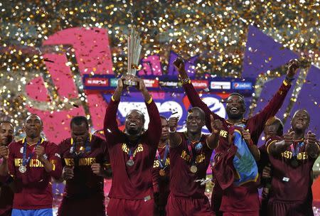 Cricket - England v West Indies - World Twenty20 cricket tournament final - Kolkata, India - 03/04/2016. West Indies players celebrate with the trophy after winning the final. REUTERS/Adnan Abidi