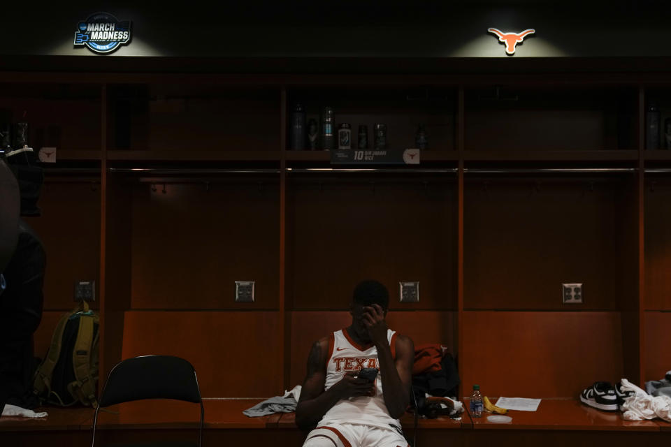 Texas guard Sir'Jabari Rice sits in the locker room after their loss against Miami in an Elite 8 college basketball game in the Midwest Regional of the NCAA Tournament Sunday, March 26, 2023, in Kansas City, Mo. (AP Photo/Jeff Roberson)
