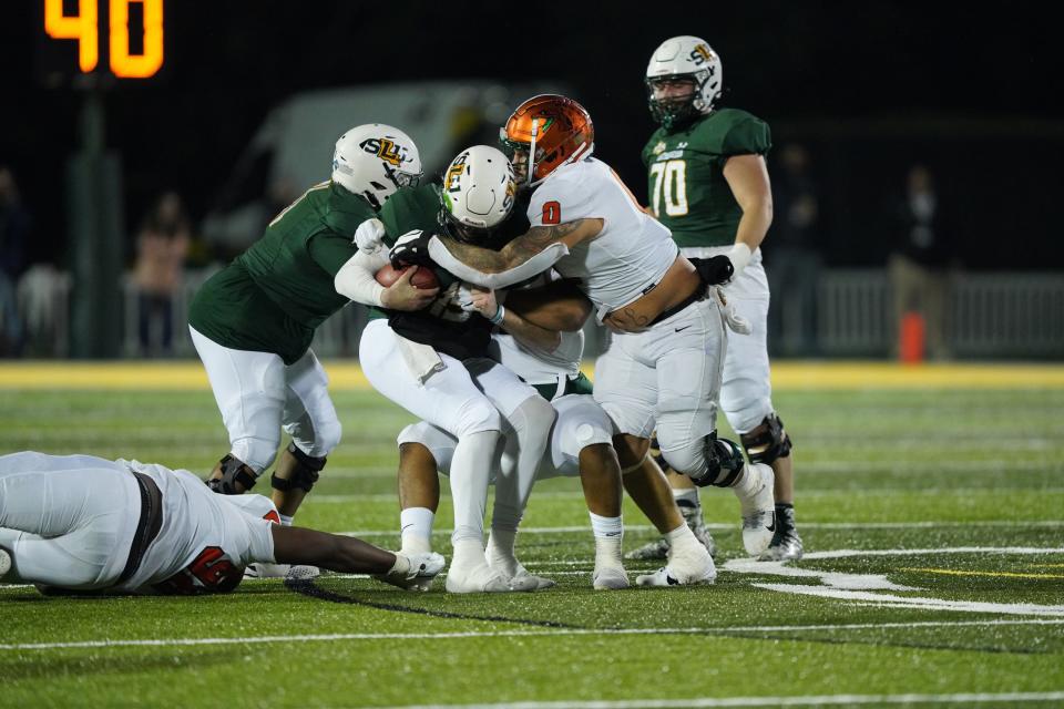 FAMU defensive lineman Savion Williams sacks Southeastern Louisiana quarterback Cole Kelley. The Lions beat the Rattlers 38-14 on Saturday, Nov. 27, 2021 in the first round of the FCS playoffs.