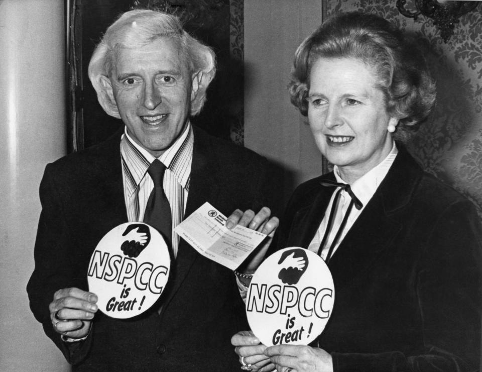 Jimmy Savile and Margaret Thatcher at a NSPCC fundraiser in 1980. (Evening Standard/Hulton Archive/Getty Images)