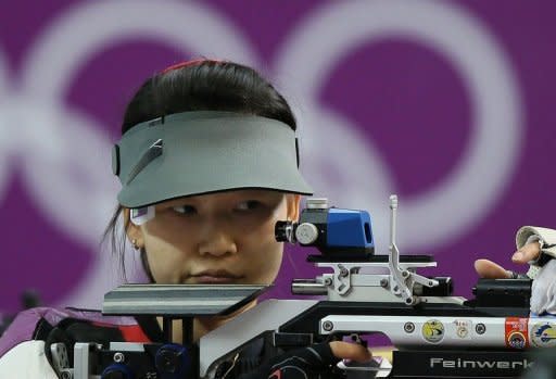 Chinese athlete Yi Siling competes in the 10m air rifle final at the London 2012 Olympic Games at the Royal Artillery Barracks in London