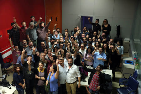 IMC TV employees gather to protest after their broadcaster's transmission cut by the authorities, based on a government decree, at IMC TV studios in Istanbul, Turkey, October 4, 2016. REUTERS/Huseyin Aldemir