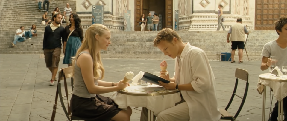 Amanda Seyfried as Sophie and Christopher Egan as Charlie sit together in Italy in "Letters to Juliet"