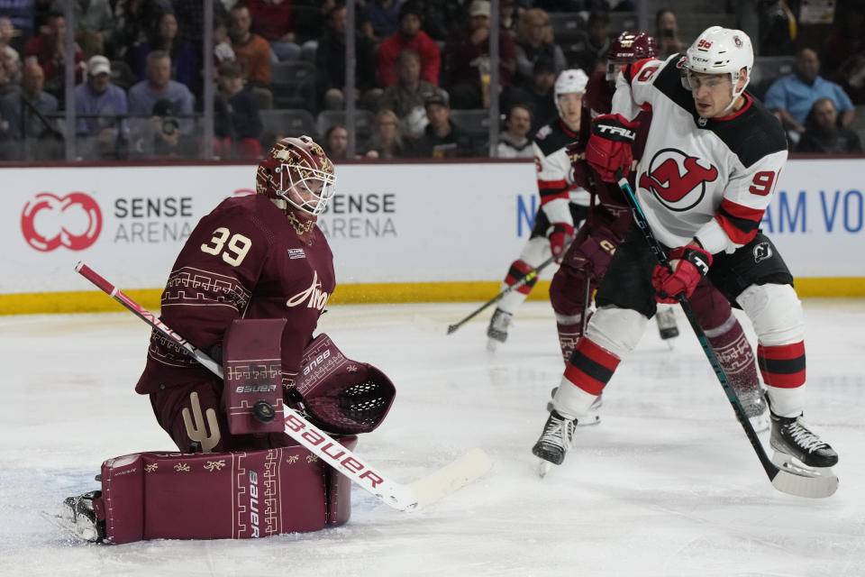 Arizona Coyotes goaltender Connor Ingram makes the save in front of New Jersey Devils right wing Timo Meier in the second period during an NHL hockey game, Sunday, March 5, 2023, in Tempe, Ariz. (AP Photo/Rick Scuteri)