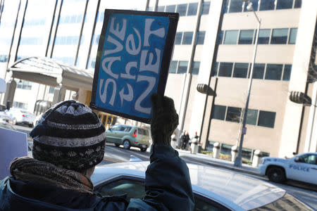 Net neutrality advocates rally in front of the Federal Communications Commission (FCC) ahead of Thursday's expected FCC vote repealing so-called net neutrality rules in Washington, U.S., December 13, 2017. REUTERS/Yuri Gripas