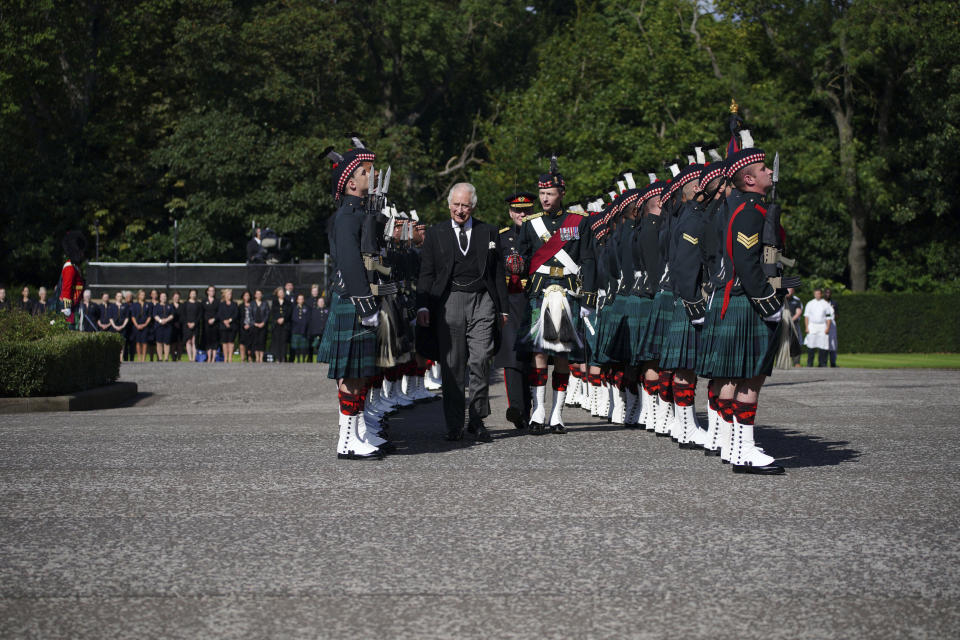 King Charles III inspects the Guard of Honour as he arrives to attend the Ceremony of the Keys, at the Palace of Holyroodhouse, Edinburgh, Monday, Sept. 12, 2022. King Charles arrived in Edinburgh on Monday to accompany his late mother’s coffin on an emotion-charged procession through the historic heart of the Scottish capital to a cathedral where it will lie for 24 hours to allow the public to pay their last respects. (Peter Byrne/Pool Photo via AP)