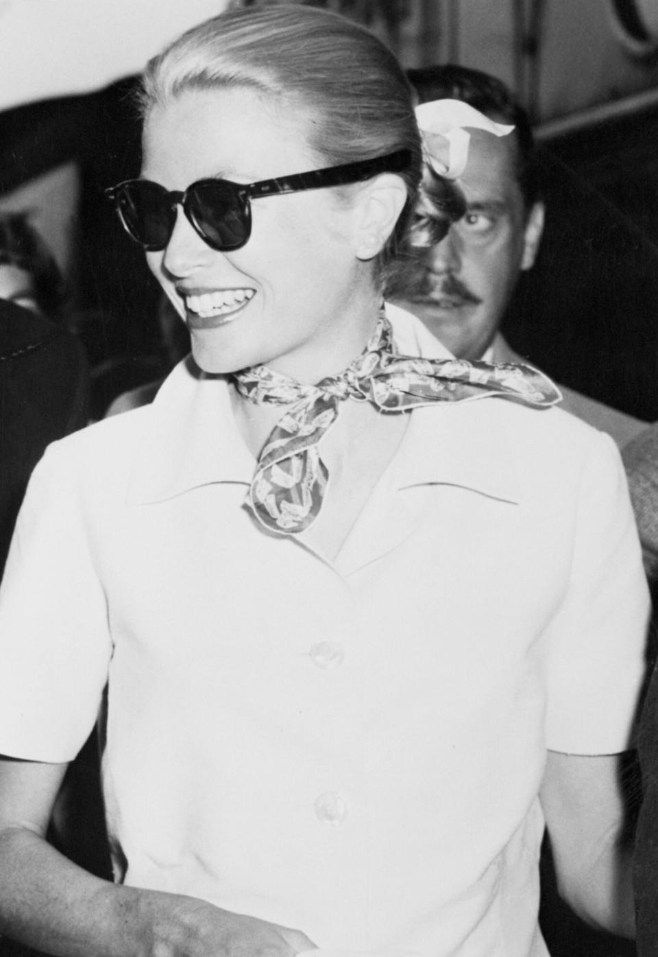 Princess Grace Kelly Arriving in Paris wearing a Gucci scarf