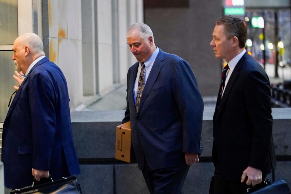 Former Ohio House Speaker Larry Householder, center, walks into Potter Stewart U.S. Courthouse with his attorneys, Mark Marein, left, and Steven Bradley, right, before jury selection in his federal trial, Jan. 20, 2023, in Cincinnati.