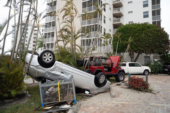 Storm damaged vehicles after Hurricane Ian on September 29, 2022, in Bonita Springs, Florida.