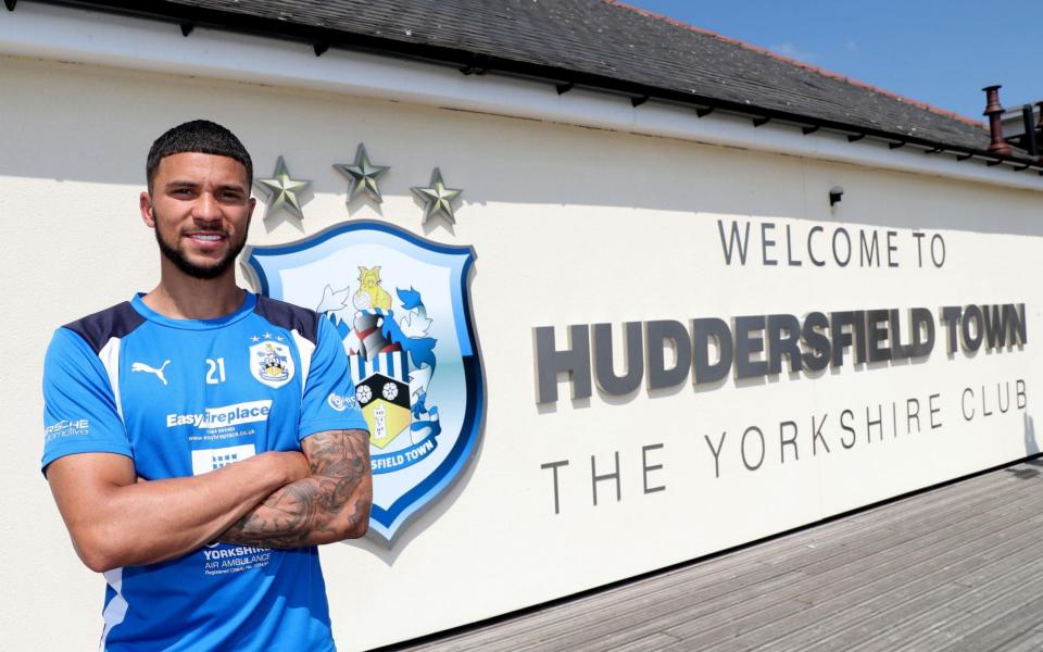 Huddersfield Town's Nahki Wells poses for a photo at PPG Canalside, Huddersfield - Credit: PA