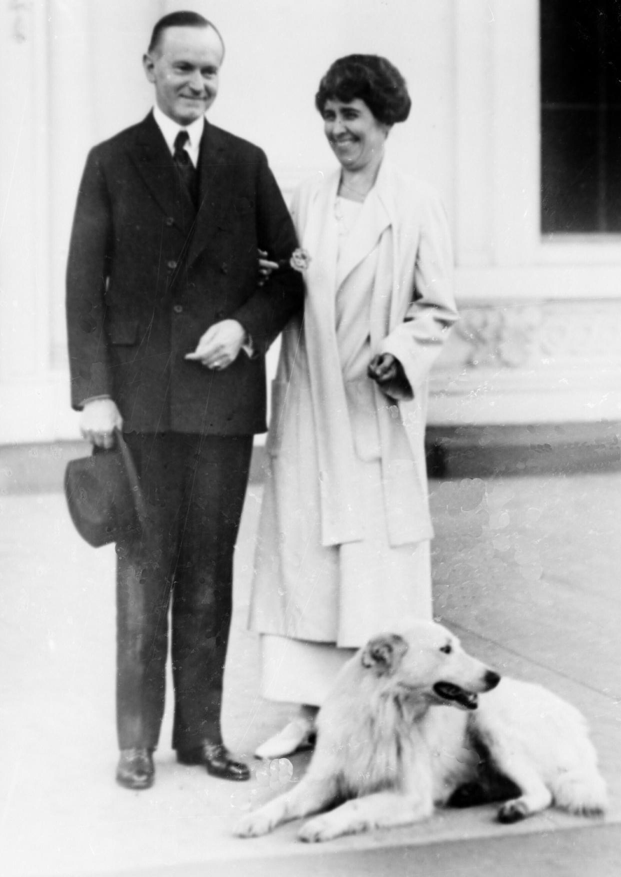 In this Nov. 5, 1924, file photo President Calvin Coolidge and first lady Grace Coolidge are shown with their dog at the White House portico in Washington. The arrival of the Biden pets will also mark the next chapter in a long history of pets residing at the White House after a four-year hiatus during the Trump administration. “Pets have always played an important role in the White House throughout the decades,” said Jennifer Pickens, an author who studies White House traditions. (AP Photo, File)