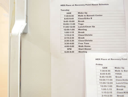 A schedule outlines the day's activities for members of the HERplace women's addictions recovery center at the Barnett Community Center in Huntington, West Virginia. REUTERS/Lexi Browning