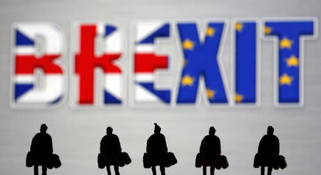 Small toy figures are seen in front of a Brexit logo in this illustration picture, March 30, 2019. REUTERS/Dado Ruvic/Illustration