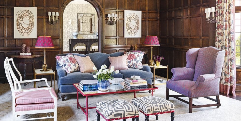 the living room’s wall lights and most of the oak paneling are original to the home