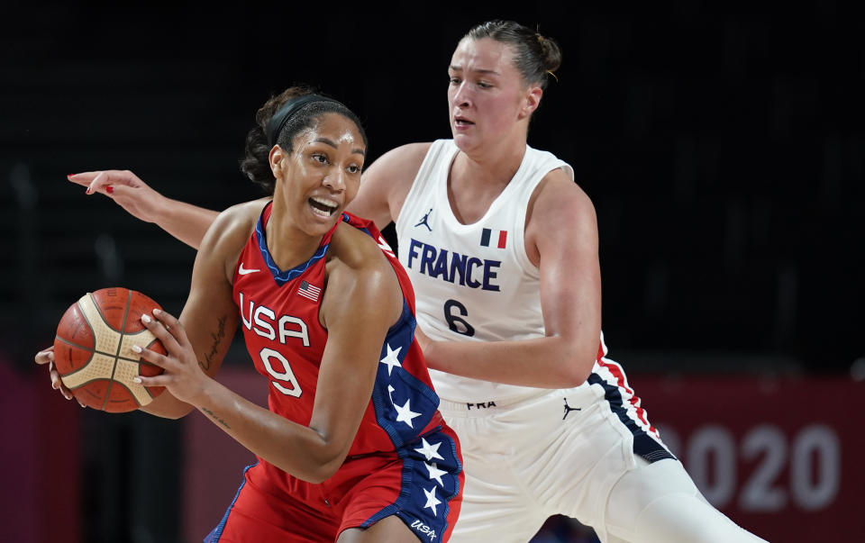 United States' A'Ja Wilson (9) drives around France's Alexia Chartereau (6) during women's basketball preliminary round game at the 2020 Summer Olympics, Monday, Aug. 2, 2021, in Saitama, Japan. (AP Photo/Charlie Neibergall)