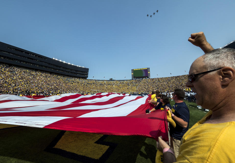 Four U.S. Air Force T-38 jets fly over Michigan Stadium before the Michigan-Air Force game on Sept. 16. (AP)